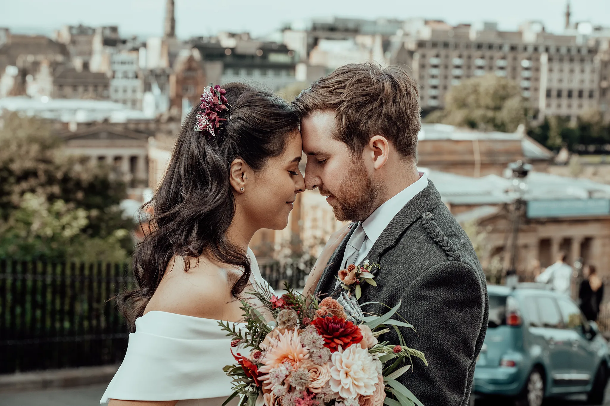 Emma and Sam wedding photo with Edinburgh at the background. 