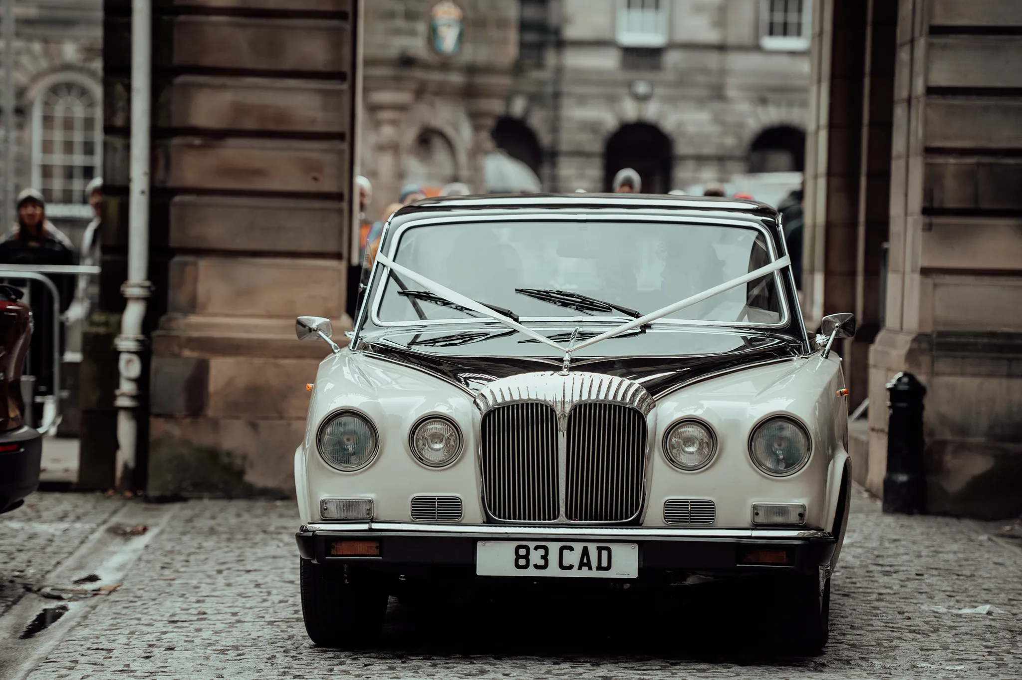 Vintage car Edinburgh arriving with bride 