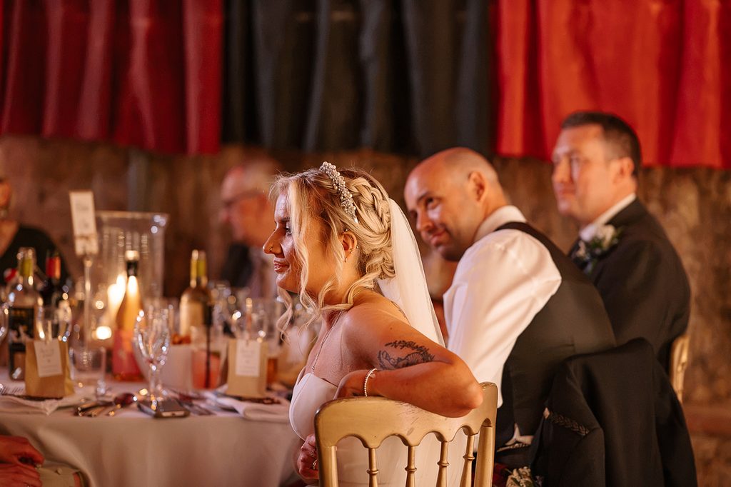 Natural wedding photograph of a bride and groom during their Edinburgh wedding reception