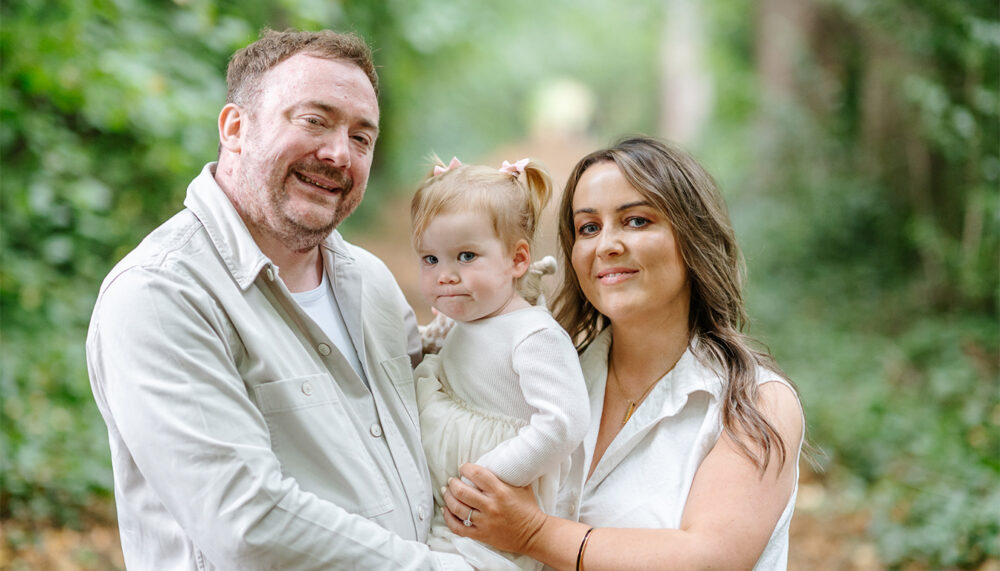 Katie, David and their daughter Bella enjoying a family picnic photoshoot at Lauriston Castle, Edinburgh