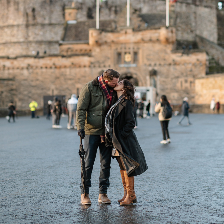 Couple enjoying an Edinburgh vacation photography session in front of Edinburgh Castle, Scotland