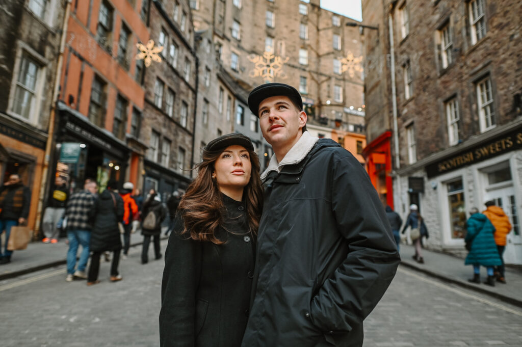 Couple enjoying a vacation photoshoot in Edinburgh Old Town