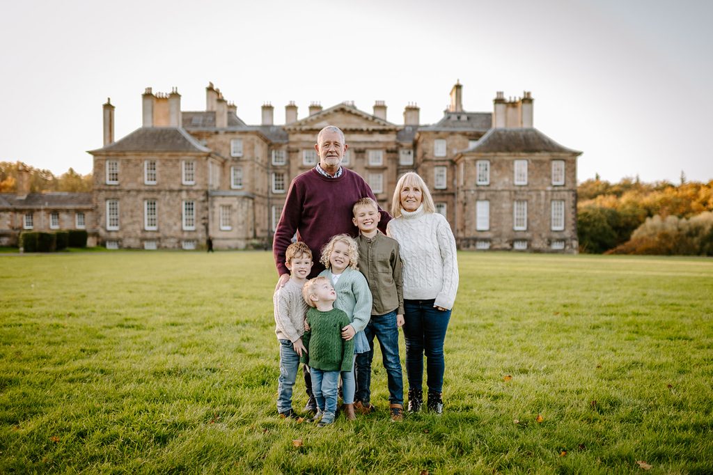 Grandparents with their grandchildren outside Dalkeith Palace at Dalkeith Country Park