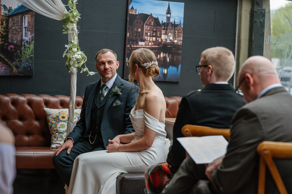Couple sharing a quiet moment during their intimate wedding ceremony in Leith
