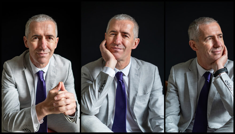 Professional corporate headshot photographed against a light background in Edinburgh